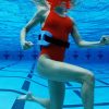 woman-with-aqua-jogger-in-pool-high-res-stock-photography-10000491-1564747646